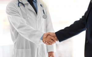 Doctor shaking patient's hand